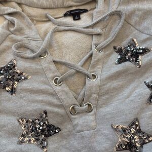 INC hoodie with sequin star accents!